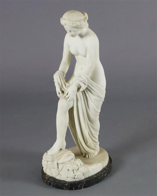 A Victorian style carved white marble figure of a woman pulling on her stocking, H.31in.